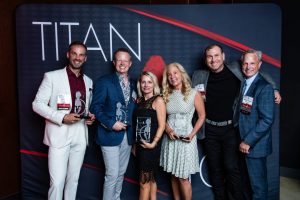 Titan 100 - Image 8 | AJ Adhesives Andy with friends, family, and other Titan 100 honorees posing for a Titan 100 photo.